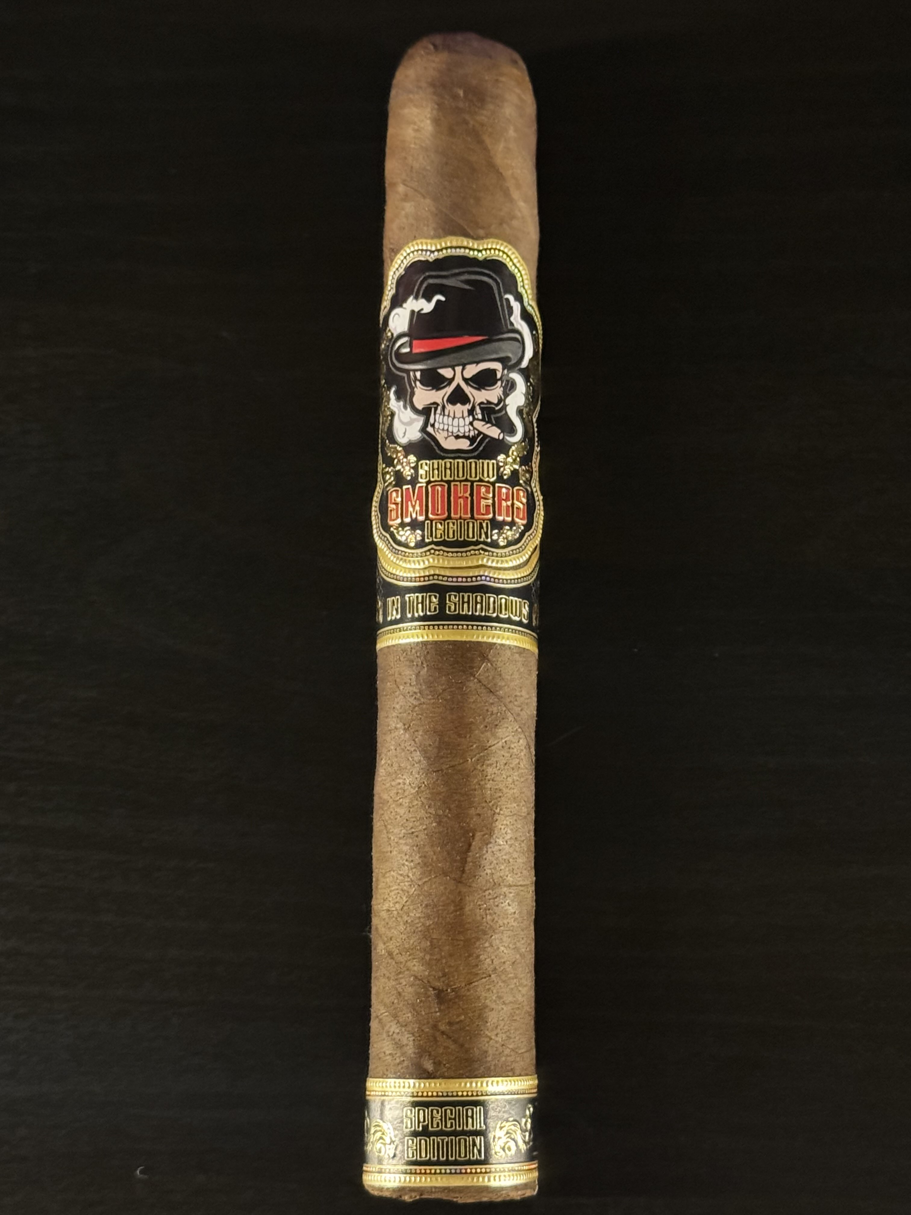 Close-up of a Project I.T.S. cigar with the Legion skull band