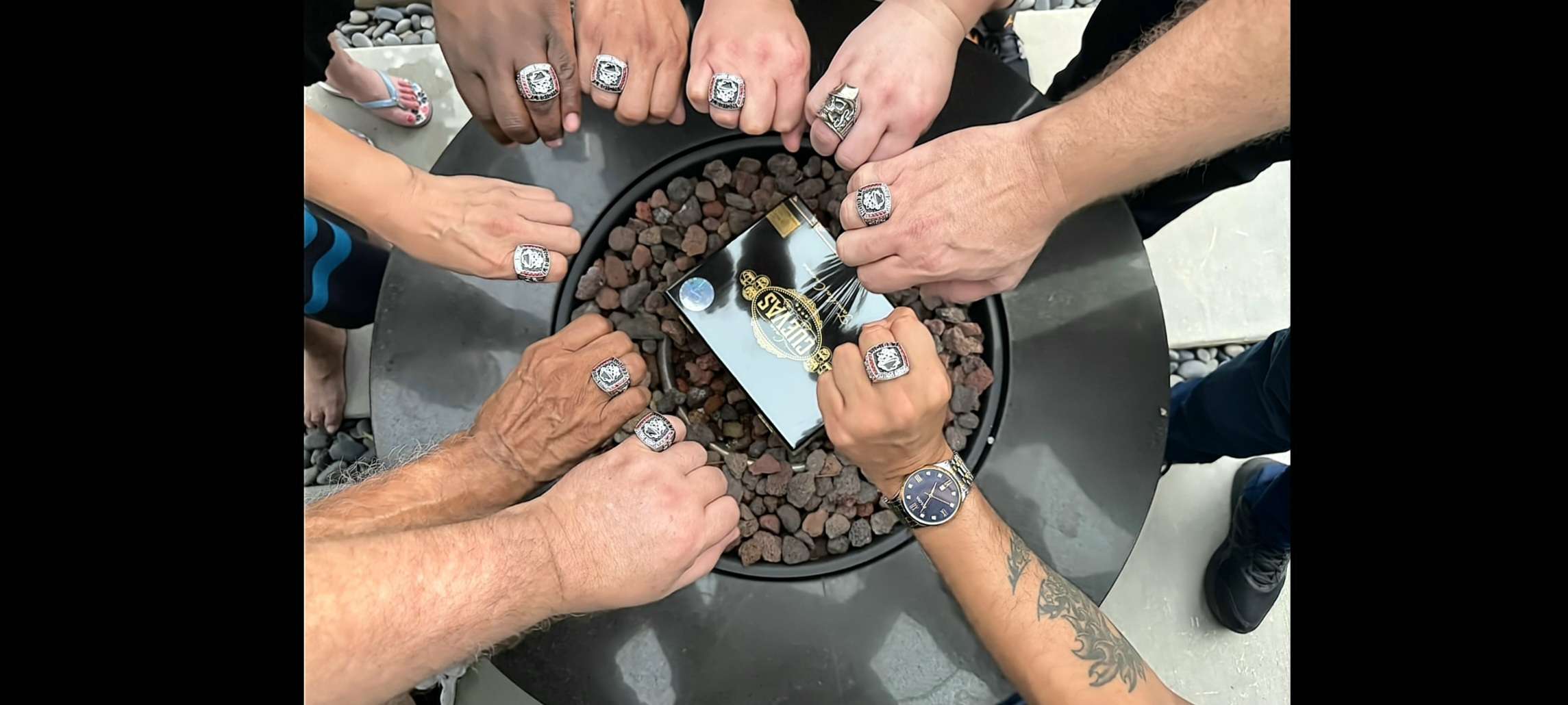 Members showing Legion rings around a fire pit
