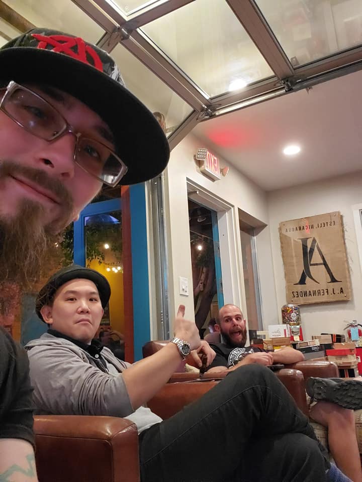 Legion members taking a photo inside a cigar shop