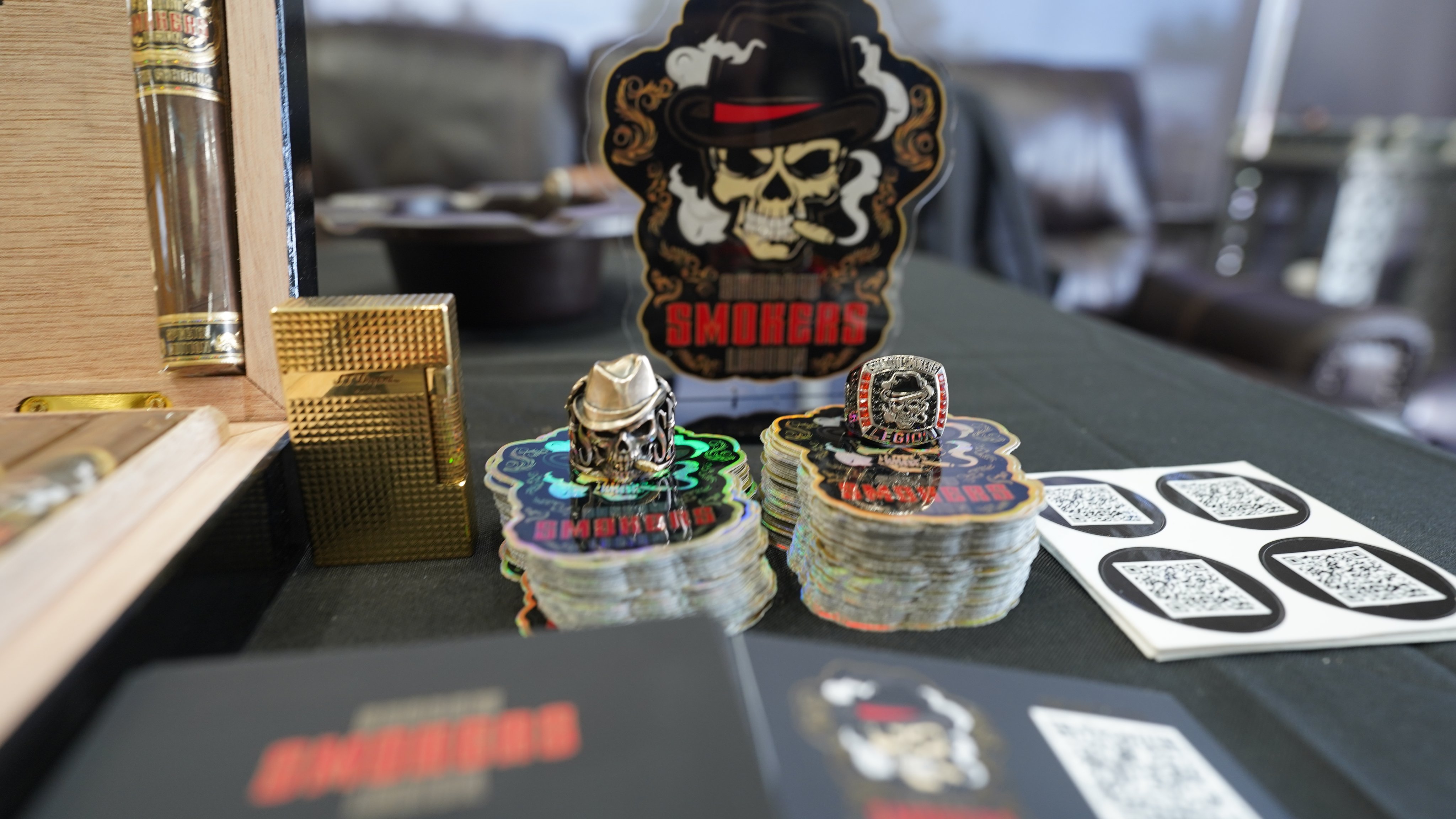 Table of Legion stickers, ring, lighter, signet and cards