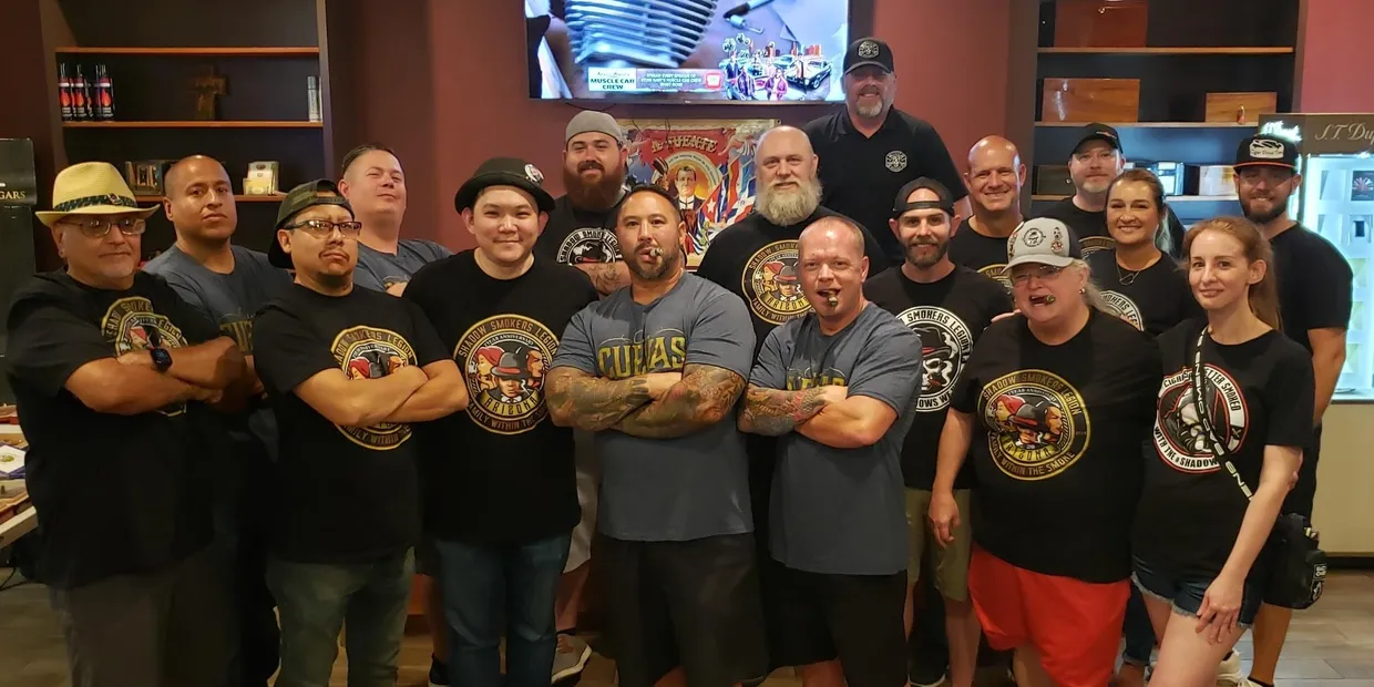 Members standing together in black Legion shirts